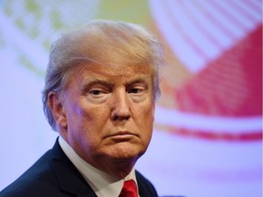 U.S. President Donald Trump arrive for a family photo during the ASEAN-U.S. 40th Anniversary commemorative Summit in Manila, Philippines, Monday, Nov. 13, 2017. (Manan Vatsyayana/Pool Photo via AP) ORG XMIT: XAF156

POOL PHOTO
Manan Vatsyayana, AP