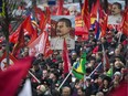 Communist party supporters carry portraits of Soviet dictator Josef Stalin during a demonstration marking the 100th anniversary of the 1917 Bolshevik revolution in Moscow this week.