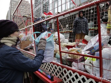 The annual Help Santa Toy Parade made its way through downtown Ottawa, featuring familiar festive floats, marching bands, city councillors, firefighters and more, with volunteers collecting toys for less fortunate children along the way, on Saturday, Nov. 18, 2017