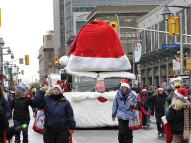 The annual Help Santa Toy Parade made its way through downtown Ottawa, featuring familiar festive floats, marching bands, city councillors, firefighters and more, with volunteers collecting toys for less fortunate children along the way, on Saturday, Nov. 18, 2017