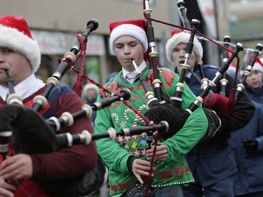 TThe annual Help Santa Toy Parade made its way through downtown Ottawa, featuring familiar festive floats, marching bands, city councillors, firefighters and more, with volunteers collecting toys for less fortunate children along the way, on Saturday, Nov. 18, 2017