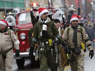 The annual Help Santa Toy Parade made its way through downtown Ottawa, featuring familiar festive floats, marching bands, city councillors, firefighters and more, with volunteers collecting toys for less fortunate children along the way, on Saturday, Nov. 18, 2017. (David Kawai)

1118 Santa Parade
David Kawai