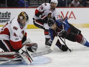 Craig Anderson, John Mitchell, Viktor Stalberg Colorado Avalanche center John Mitchell, front right, falls in front of Ottawa Senators left wing Viktor Stalberg, back right, of Sweden, as Senators goalie Craig Anderson makes a save in the first period of an NHL hockey game Saturday, March 11, 2017, in Denver.