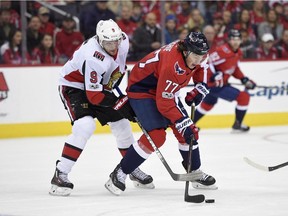 Ottawa Senators right wing Bobby Ryan (9) vies for the puck against Washington Capitals right wing T.J. Oshie (77) Wednesday, Nov. 22, 2017, in Washington.