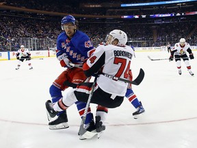 The Rangers' Brendan Smith takes a five-minute major and a game misconduct for interference against the Senators' Mark Borowiecki.