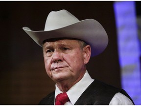 In this Monday, Sept. 25, 2017, file photo, former Alabama Chief Justice and U.S. Senate candidate Roy Moore speaks at a rally, in Fairhope, Ala. Nine women have come forward to accuse him of inappropriate conduct. Andrew Cohen writes about why the GOP establishment in Alabama is sticking by him. AP Photo/Brynn Anderson, File