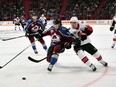 Colorado's Chris Bigras, left, and Ottawa's Jean-Gabriel Pageau battle for puck possession during Friday's game at the Ericsson Globe arena in Stockholm. Erik Simander/TT via AP