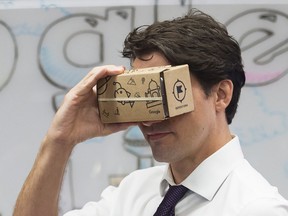 Prime Minister Justin Trudeau takes part in a virtual reality demonstration at the new Google Canada Development headquarters in Kitchener, Ont.