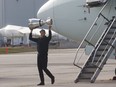 Toronto Argonauts quarterback Ricky Ray comes off the Argonauts charter plane at Pearson with the Grey Cup on Monday November 27, 2017. Stan Behal/Toronto Sun/Postmedia Network