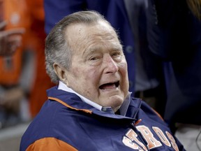 Former President George H.W. Bush waits on the field for first pitch ceremony before Game 5 of baseball's World Series against the Los Angeles Dodgers Sunday, Oct. 29, 2017, in Houston.