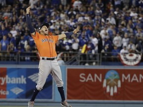 Houston Astros' Carlos Correa celebrates after Game 7 of baseball's World Series against the Los Angeles Dodgers Wednesday, Nov. 1, 2017, in Los Angeles. The Astros won 5-1 to win the series 4-3. (AP Photo/David J. Phillip)