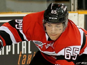 Shaw Boomhower (L) looks to make a pass with Peter Stratis close behind during the second period as the Ottawa 67's take on the Mississauga Steelheads in Ontario Hockey League playoff action at TD Place Arena. The series is tied at one game apiece going into tonight's matchup. Wayne Cuddington/Postmedia