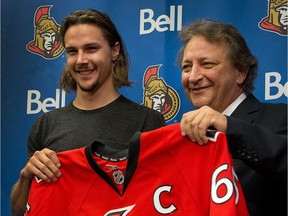 Senators defenceman Erik Karlsson with owner Eugene Melnyk when Karlsson was named team captain in 2014.