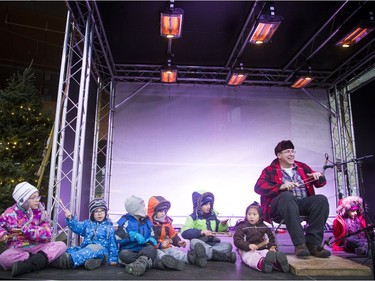 Performer Louis Mercier had a stage full of children to help him with a performance featuring wooden spoons during the Mayor's 17th Annual Christmas Celebration.   Ashley Fraser/Postmedia