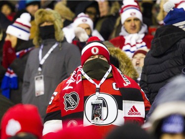 A fan was well bundled during the Ottawa Senators and Montreal Canadiens NHL 100 Classic in Ottawa on Saturday December 16, 2017 at TD Place.   Ashley Fraser/Postmedia