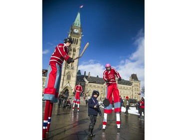Seven-year-old Nico Carlomusto was the human puck while he played in a hockey game with the Ottawa Stilt Union performers, part of the Canada 150 events on Parliament Hill Saturday December 16, 2017.