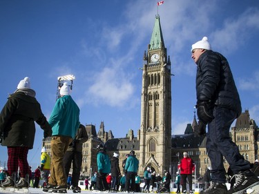People braved the chilly temperatures to enjoy a skate in the sunshine on Parliament Hill, part of the Canada 150 events on Parliament Hill Saturday December 16, 2017.