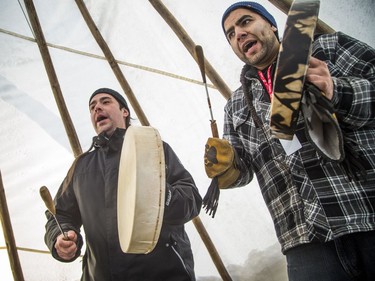 L-r singers Yancey Thusky of Barriere Lake and Awema Tendesi of Kitigan Zibi led "Tewehgan" hand drum lessons in a tipi, part of the Canada 150 events on Parliament Hill Saturday December 16, 2017.