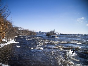 David Alicandro didn't let a little cold weather stop him from getting out for a surf Saturday December 16, 2017 on the Ottawa River.