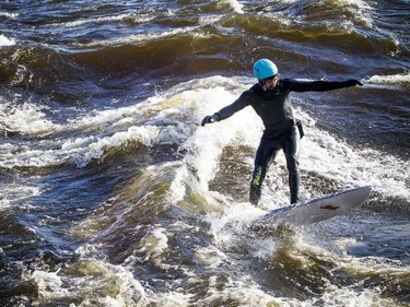 David Alicandro didn't let a little cold weather stop him from getting out for a surf Saturday December 16, 2017 on the Ottawa River.