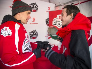 Jacob Pomerleau gets his hat signed by former Ottawa Senators player Wade Redden.
