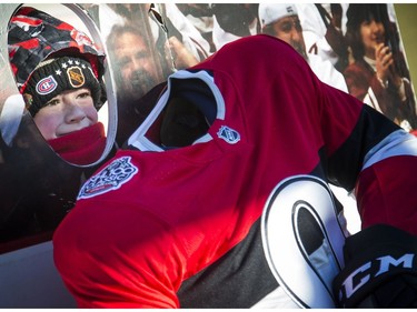 The official tailgate party of the 2017 Scotiabank NHL100 Classic took place at Lansdowne Saturday, Dec. 16, 2017. Nine-year-old Sam Murphy from Nova Scotia poses for a photo in the hockey player cutouts.
