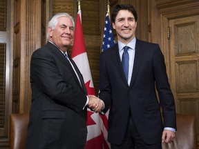 Prime Minister Justin Trudeau shakes hands with US Secretary of State Rex Tillerson at the start of a meeting on Parliament Hill in Ottawa, Tuesday, December 19, 2017.