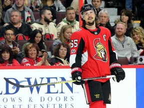 Erik Karlsson back on ice during first-period action between the Ottawa Senators (red) and the Vancouver Canucks Tuesday (October 17, 2017) at Canadian Tire Centre.