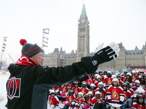 Eugene Melnyk, owner of the Ottawa Senators, addresses close to 100 kids who attended his annual Skate for Kids on the outdoor rink on Parliament Hill in Ottawa, December 10, 2017.