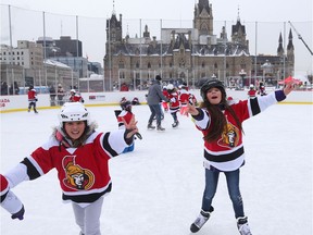 Nell Bettencourt (R) and her friend learn how to skate during the annual Skate for Kids on the outdoor rink on Parliament Hill in Ottawa, December 10, 2017.   Special Canada 150 edition of the Melnyk Family Skate for Kids. For the 14th consecutive year, the Ottawa Senators owner will host approximately 100 children at his annual Skate for Kids. This year's participating students attend General Vanier Public School and Assumption Catholic School.