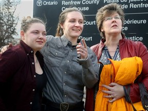 Murder victim Nathalie Warmerdam's daughter, Valerie Warmerdam (centre, seen here with Warmerdam's best friend, Tracey McBain, and her son's girlfriend, Kristy Schultz, left), was "relieved" by the lengthy sentence of the man she called her "stepfather." Triple murderer Basil Borutski was sentenced to 70 years for the deaths of three women (Nathalie Warmerdam, Anastasia Kuzyk and Carol Culleton) Wednesday at the Renfrew County Courthouse in Pembroke.
