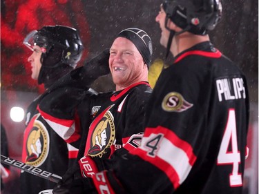 Chris Neil, who just retired, lets out a belly laugh at something his teammate Chris Phillips said. In front of Parliament Hill, the NHL 100 Classic, featuring Ottawa Senators alumni players from 25 years, thrilled the fans in Ottawa Friday (Dec. 15, 2017) night. Julie Oliver/Postmedia