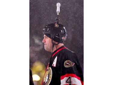 Chris Phillips was sporting some odd helmet cam that looked like a light bulb. In front of Parliament Hill, the NHL 100 Classic, featuring Ottawa Senators alumni players from 25 years, thrilled the fans in Ottawa Friday (Dec. 15, 2017) night. Julie Oliver/Postmedia