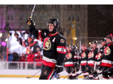 Wade Redden waves his stick at the crowd before the first period. In front of Parliament Hill, the NHL 100 Classic, featuring Ottawa Senators alumni players from 25 years, thrilled the fans in Ottawa Friday (Dec. 15, 2017) night. Julie Oliver/Postmedia