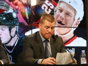 Chris Neil, collects his thoughts while announcing his retirement from the NHL at Canadian Tire Centre in Ottawa, December 14, 2017.