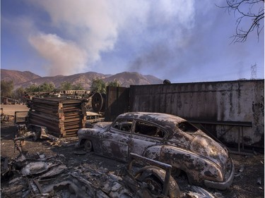 SYLMAR, CA - DECEMBER 06: A burned classic car is seen in Little Tujunga Canyon during the Creek Fire on December 6, 2017 near Sylmar, California. Strong Santa Ana winds are pushing multiple wildfires across the region, expanding across tens of thousands of acres and destroying hundreds of homes and structures.