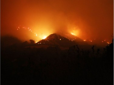 OJAI, CA - DECEMBER 06:  Fires burn in the mountains on December 6, 2017 near Ojai, California. Strong Santa Ana winds are rapidly pushing multiple wildfires across the region, expanding across tens of thousands of acres and destroying hundreds of homes and structures.