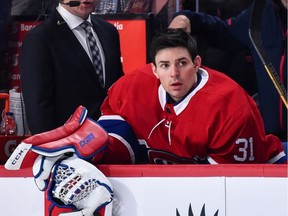 Canadiens goaltender Carey Price watches the game from the bench against the Edmonton Oilers at the Bell Centre on Saturday, Dec. 9, 2017.