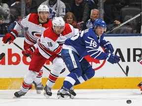 Mitchell Marner #16 of the Toronto Maple Leafs sets up a play against the Carolina Hurricanes during an NHL game at the Air Canada Centre on December 19, 2017 in Toronto, Ontario, Canada. The Maple Leafs defeated the Hurricanes 8-1.