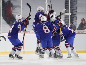 U.S. team members celebrate after Friday's shootout victory against Canada at Orchard Park, N.Y.