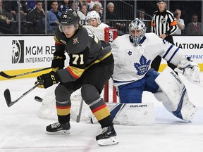 William Karlsson (71) of the Golden Knights tries to control the puck as Maple Leafs goalie Frederik Andersen looks on during the second period of Sunday's game. Karlsson scored three goals as the Golden Knights won 6-3.