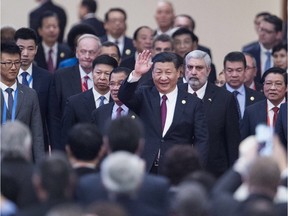 China's President Xi Jinping (C) arrives with visiting leaders at the opening ceremony of a high-level meeting held by the Communist Party of China (CPC) at the Great Hall of the People on December 1, 2017. Jean Chrétien can be seen in a red tie. FRED DUFOUR/AFP/Getty Images