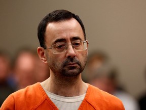 This file photo taken on Nov. 22 shows former Michigan State University and USA Gymnastics doctor Larry Nassar appearing in court at Lansing, Mich.