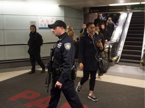 Port Authority Police watch as people evacuate after a reported explosion at the Port Authority Bus Terminal on Dec. 11, 2017 in New York. Phil Gurski says there was a collective shrug – the right response.