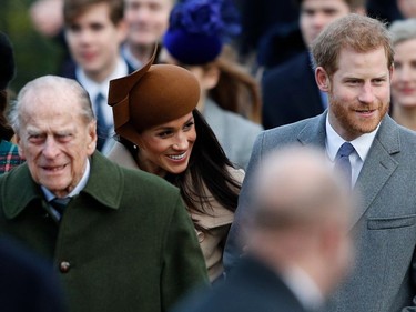 (L-R) Britain's Prince Philip, Duke of Edinburgh, US actress and fiancee of Britain's Prince Harry Meghan Markle and Britain's Prince Harry (R) arrive to attend the Royal Family's traditional Christmas Day church service at St Mary Magdalene Church in Sandringham, Norfolk, eastern England, on December 25, 2017.