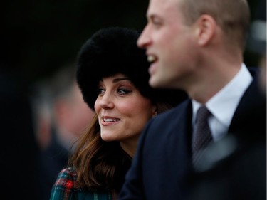 Britain's Prince William, Duke of Cambridge, (R) and Britain's Catherine, Duchess of Cambridge, (L) greet well-wishers as they leave after attending the Royal Family's traditional Christmas Day church service at St Mary Magdalene Church in Sandringham, Norfolk, eastern England, on December 25, 2017.