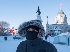 People walk through snow on a cold day in Quebec City, Canada on December 27, 2017. In Canada, extreme cold warnings were issued for scores of communities across the country, including the heavily-populated provinces of Ontario and Quebec. While Toronto reported temperatures of minus 15 C (5 F) and Ottawa minus 25 C, the coldest spot in Canada was minus 42.8 C in Armstrong, Ontario, according to Environment Canada.