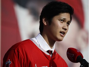 Baseball player Shohei Ohtani speaks at a news conference at Angel Stadium in Anaheim on Saturday.