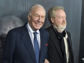 Christopher Plummer, left, and director Ridley Scott arrive at the world premiere of "All the Money in the World" at the Samuel Goldwyn Theater on Monday, Dec. 18, 2017, in Beverly Hills, Calif.