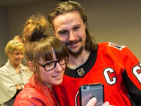 Patient Skylar Nelson, 17, takes a selfie with Erik Karlsson  as the Ottawa Senators make their annual holiday visit to CHEO to bring a little cheer into the lives of patients, their parents and a few of the staff at the childrens hospital.